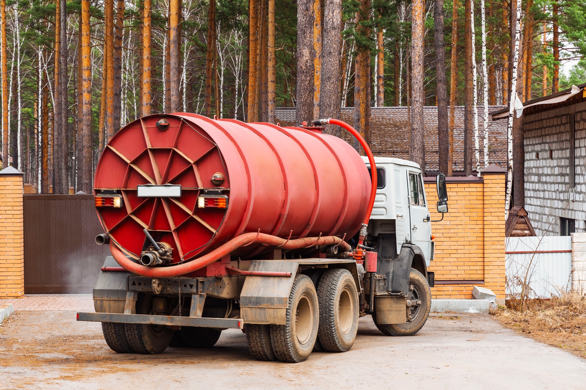 Sewage Tank truck. Sewer pumping machine. Septic truck. Pumping out sewage from a septic tank. Septic tank service